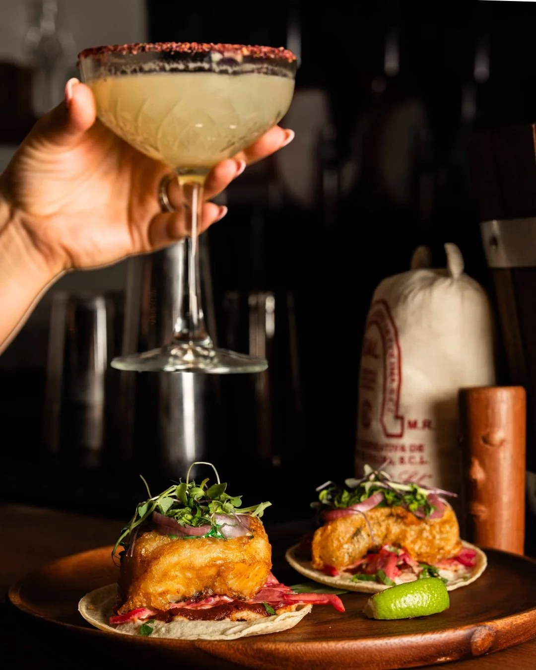 Cocktail and tacos served at Copal
